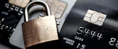 lock sitting on top of cards