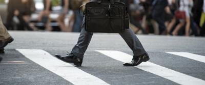 person walking on crosswalk bg