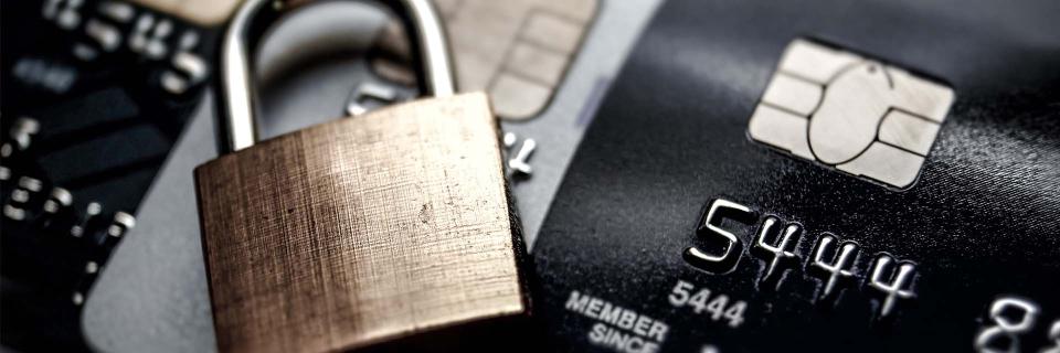 lock sitting on top of cards