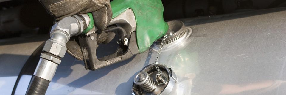 person using diesel fuel nozzle